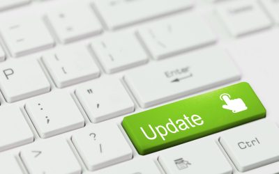 red key with text BackUp and touch finger icon on white laptop keyboard.